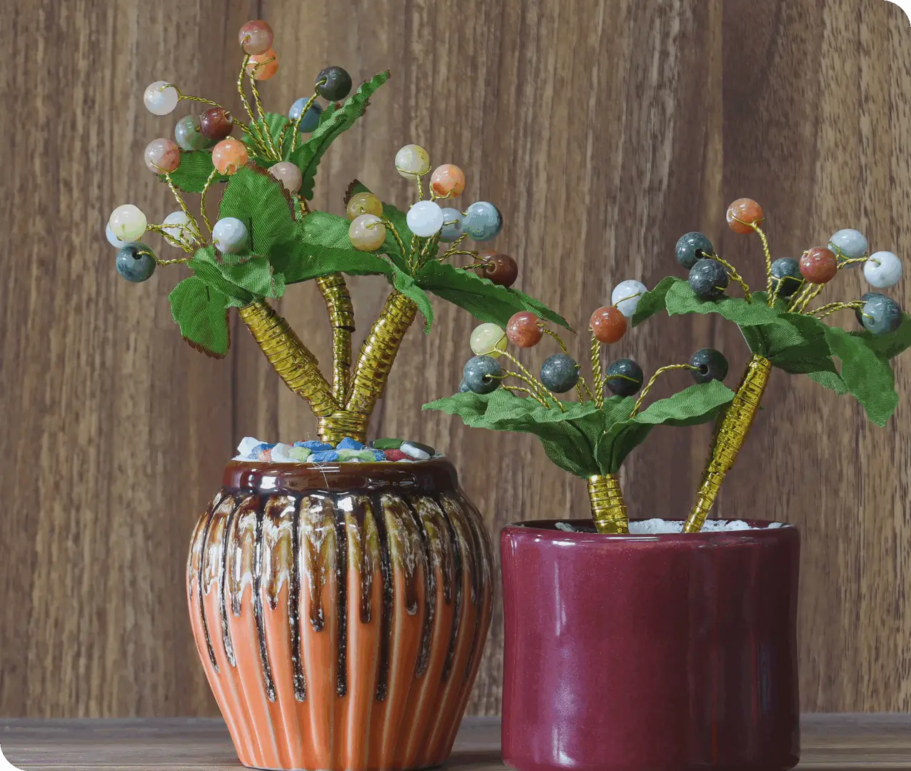 Beaded bonsai with green leaves in orange pot